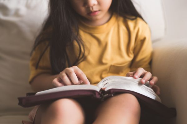 Child reading Bible
