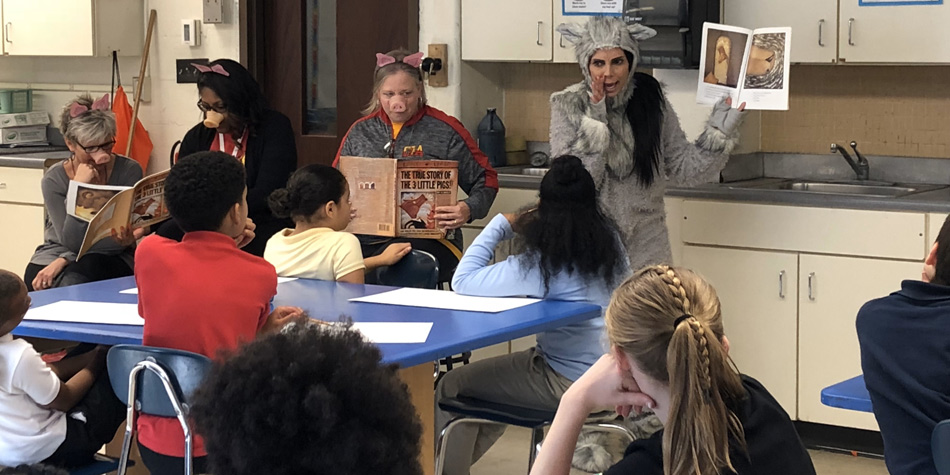 Dr. Ruiz reads to students Dr. Ruiz reads to students